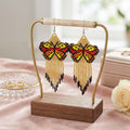 Gold Beaded Dancing Wing Earrings