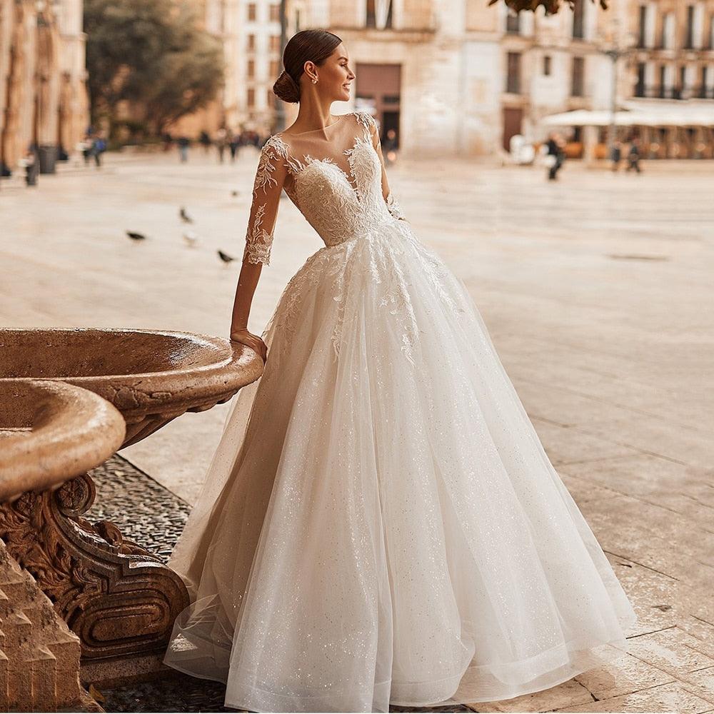 Elegant Ivory A-Line Wedding Dress with Illusion Scoop Neck, Lace Appliqués & Half Sleeves