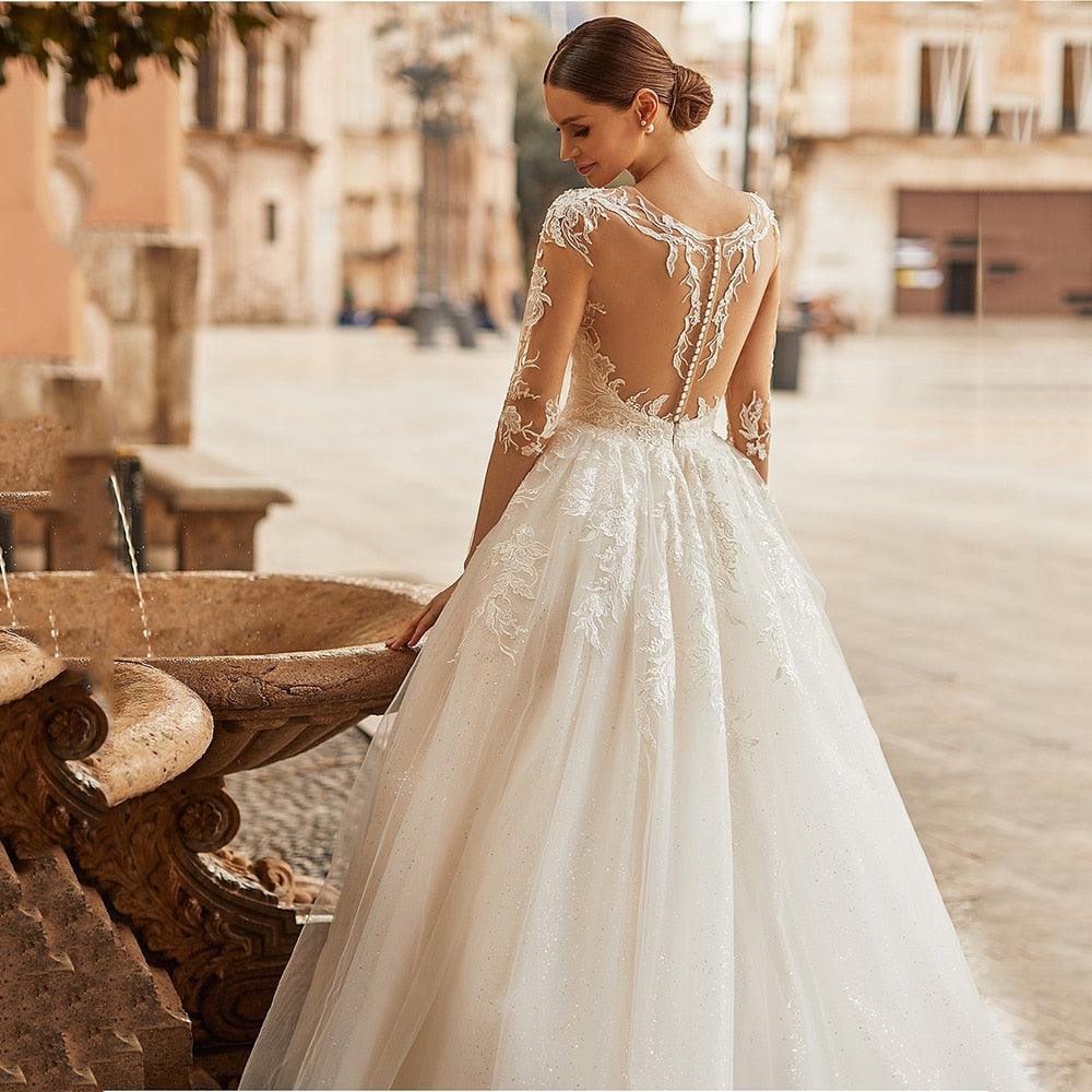 Elegant Ivory A-Line Wedding Dress with Illusion Scoop Neck, Lace Appliqués & Half Sleeves