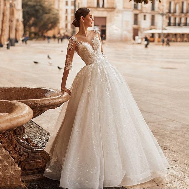 Elegant Ivory A-Line Wedding Dress with Illusion Scoop Neck, Lace Appliqués & Half Sleeves